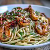 Spicy chili-garlic shrimp sautéed to perfection, tossed with al dente linguine and vibrant herbs for a restaurant-quality pasta.  