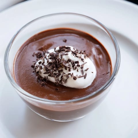 Decadent, dark chocolate pudding, a creamy delight perfect for a special occasion.