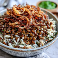 Levantine Mujadara: fluffy rice and lentils topped with golden crispy onions.